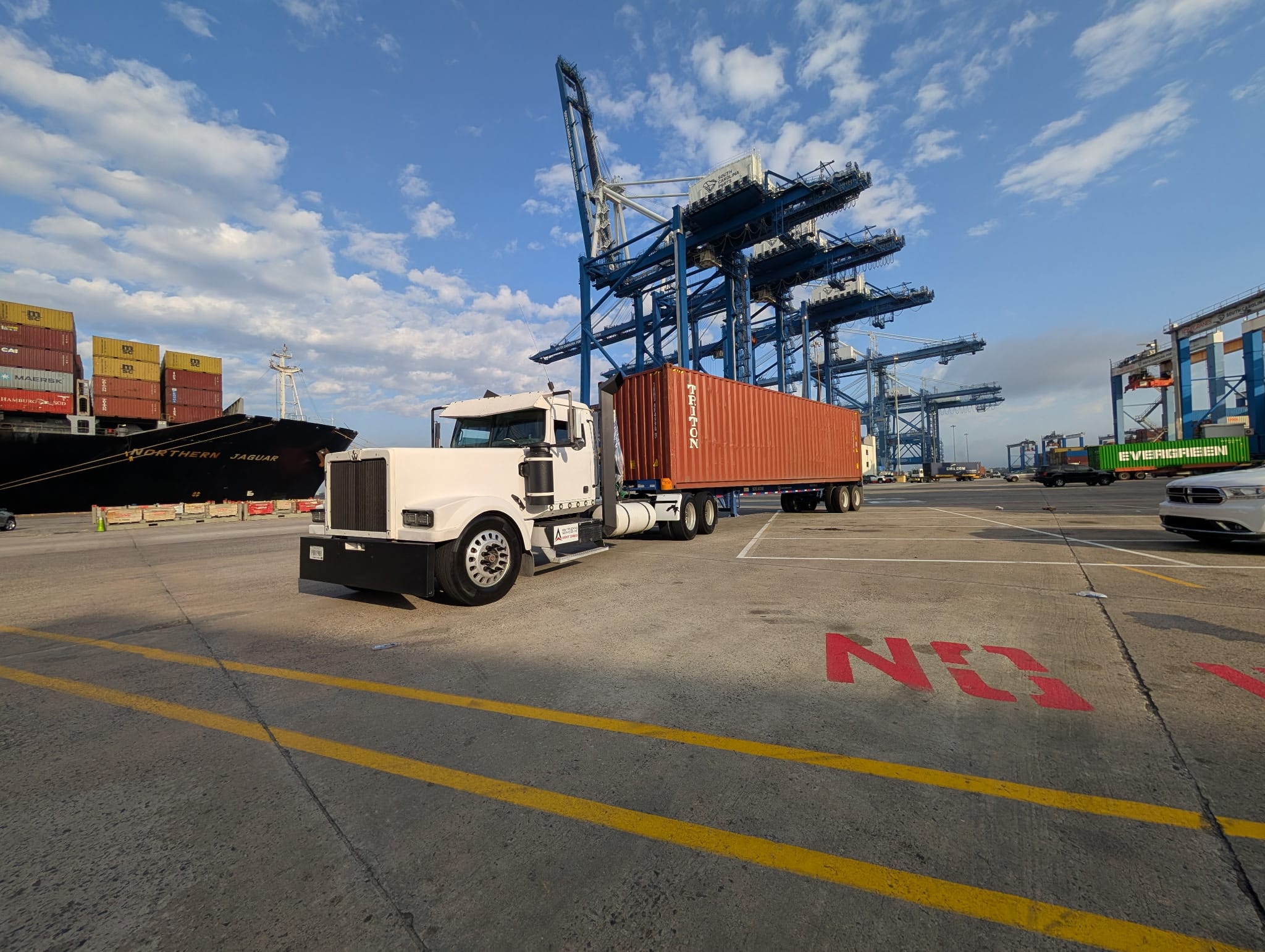 AIM Trucking tractor hauling a container at the Port of Charleston